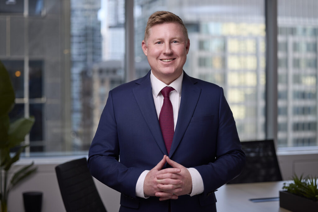 An image of Trevor Hunt in the boardroom at Our Family Office in Toronto Canada